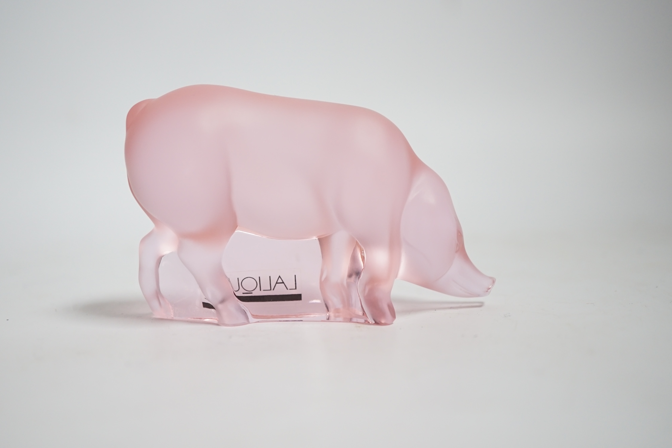 A modern Lalique pink glass pig, signed, 9cm wide